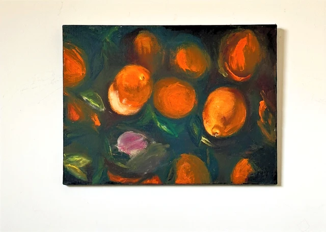 Bright oranges and green leaves arranged against a deep blue-green background. Oranges, by Evelyn Altman.