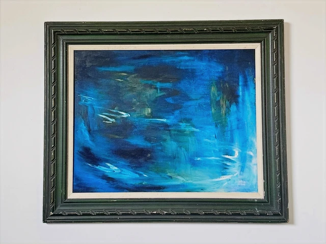 Swirling cobalt and turquoise water with light reflections and dark reeds at the edge of a lagoon. Blue Lagoon, by Evelyn Altman.