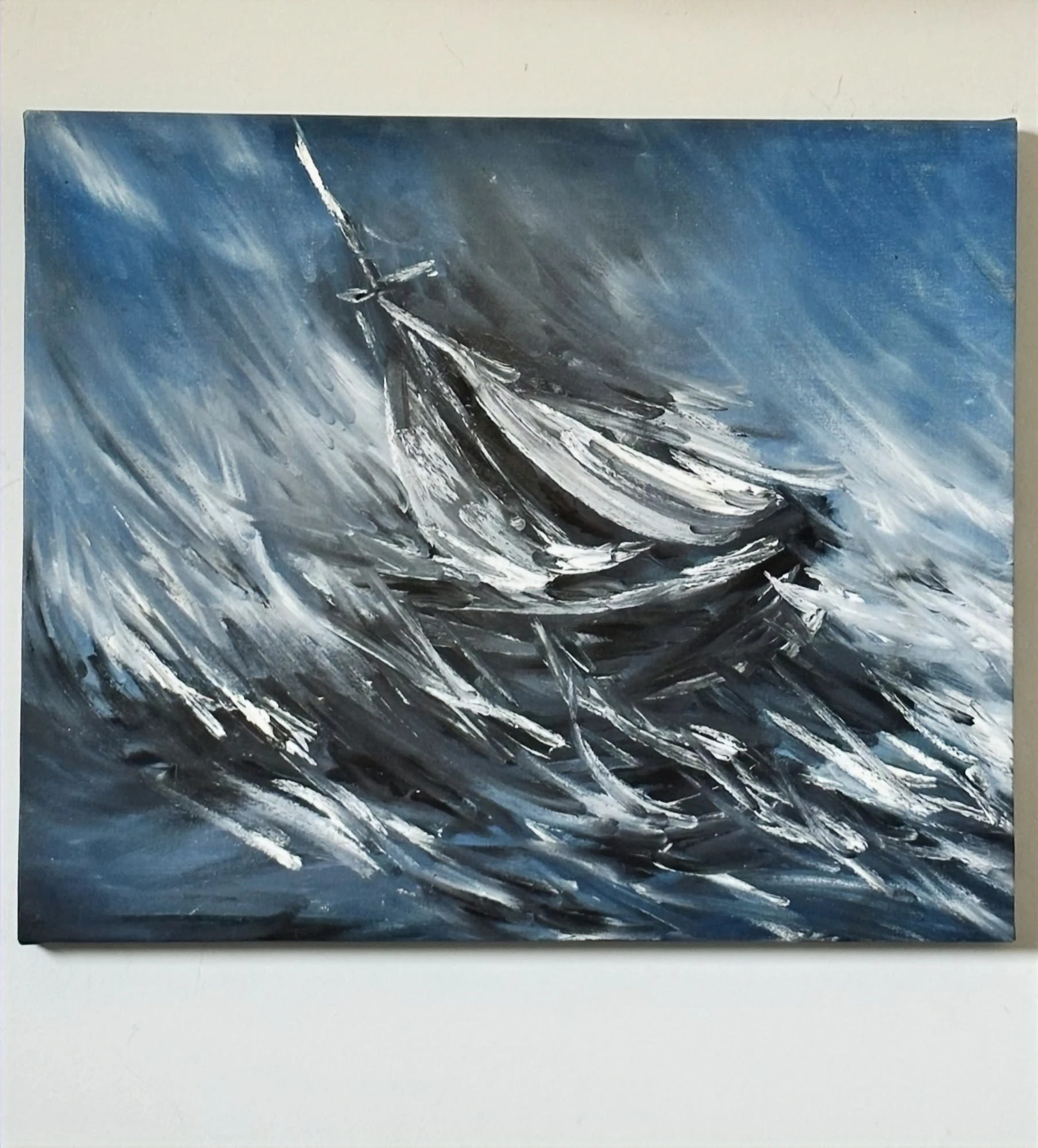 A sailboat leaning through a storm, surrounded by sweeping gray and white waves. Sailboat in A Storm, by Evelyn Altman.