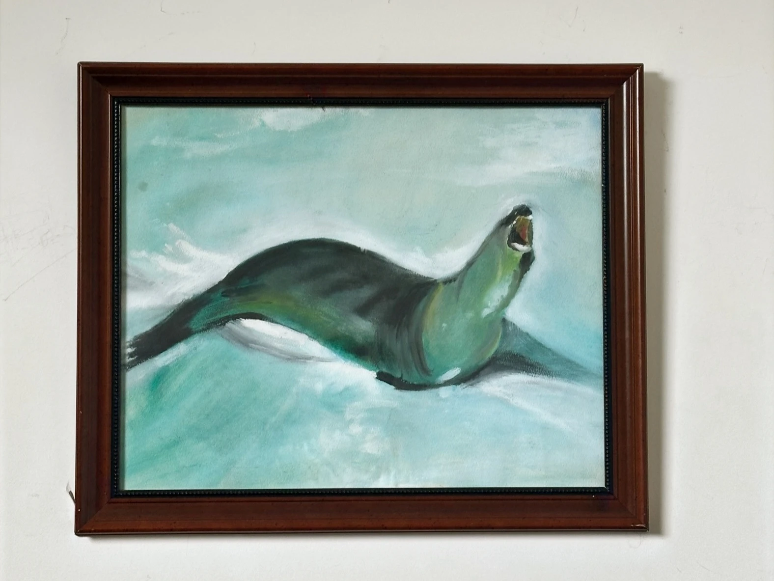 A dark seal gliding through pale green water with its head raised. Seal, by Evelyn Altman.