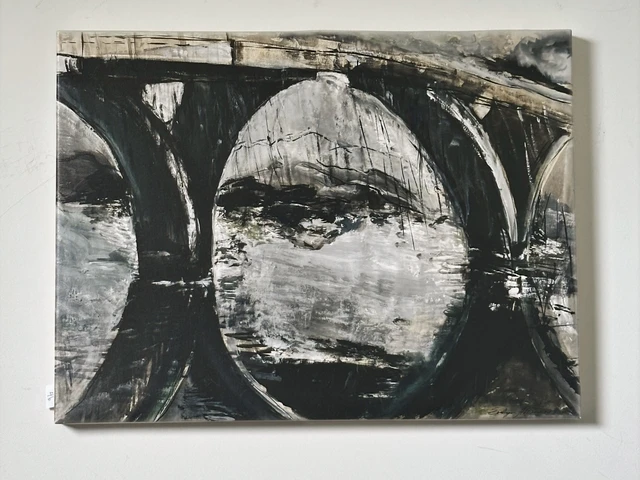 Dark bridge arches and their reflections forming circles over silvery water. Foster City Bridge California, by Evelyn Altman.