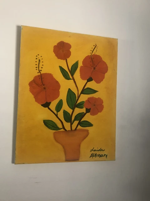 Red hibiscus flowers and dark green leaves in a terracotta-colored pot against a yellow background. Red Flower Hibiscus, by Laida Altman.