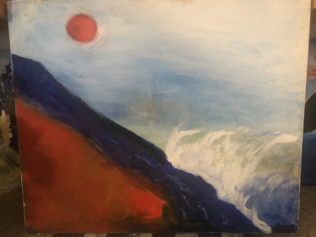 White surf sweeping along dark blue and red coastal slopes beneath a pale sky and orange-red sun. Hills Over The Waves Under The Sun, by Laida Altman.